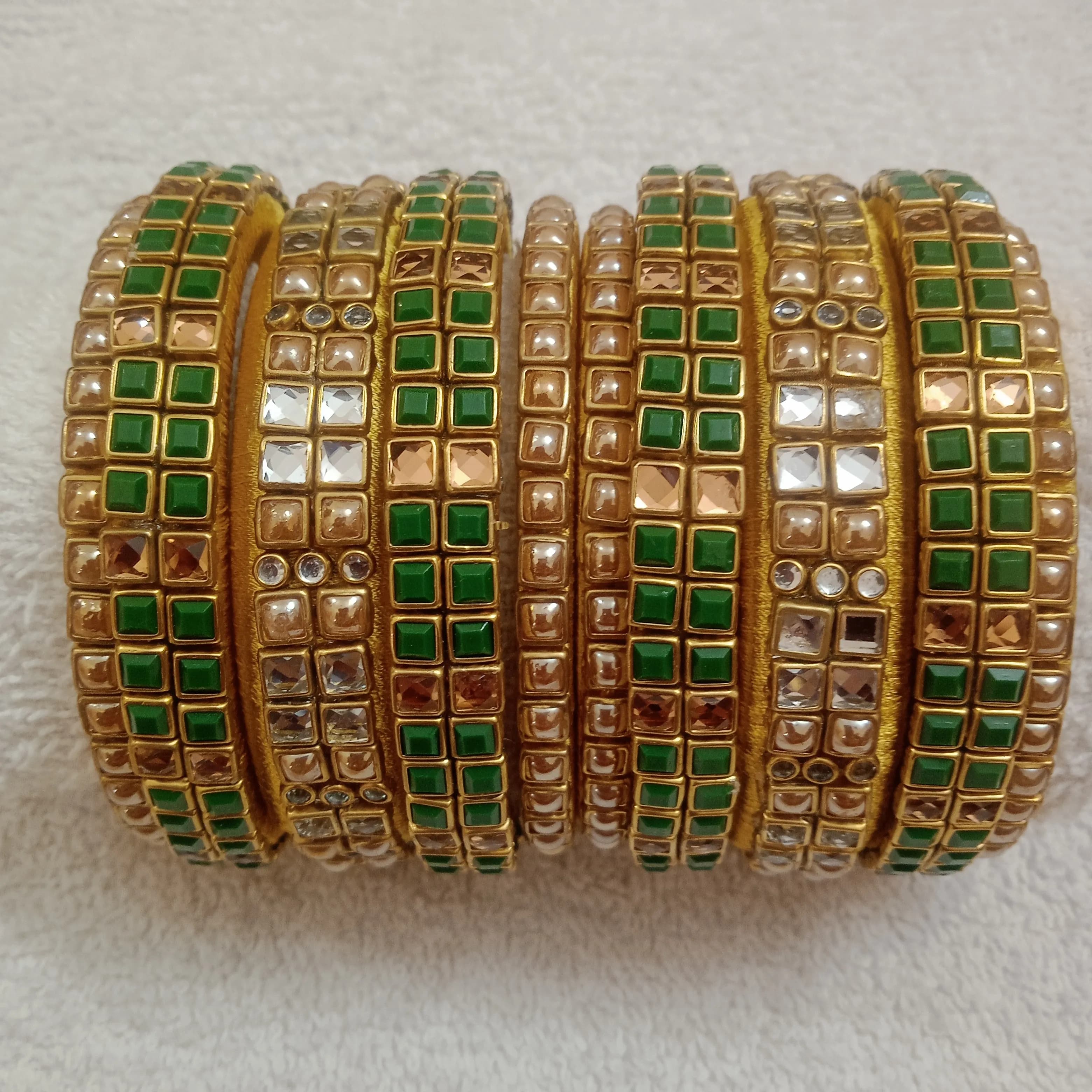Glozzy white and gold with matt green kundan stone silk thread bangles